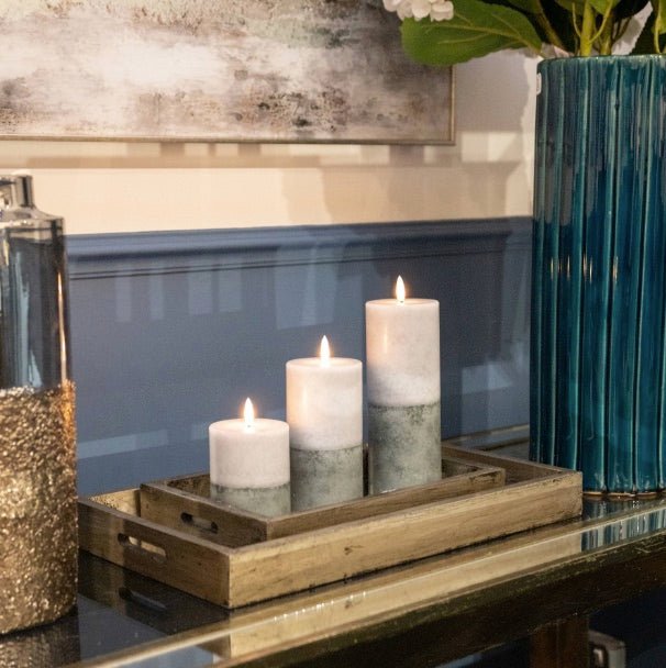 All three sizes of two tone grey LED candles, on a decorative tray