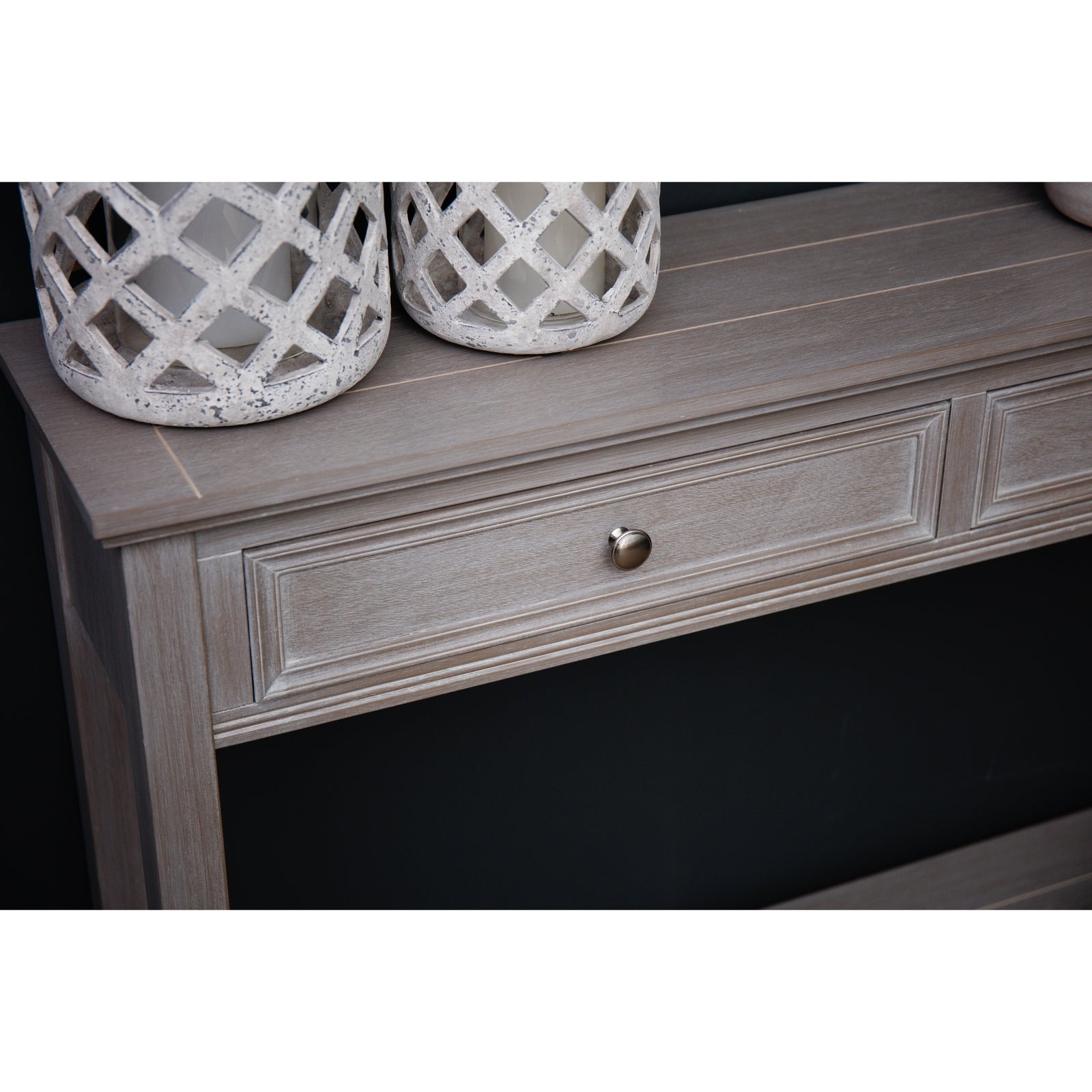 two drawer console table with candle lanterns on top