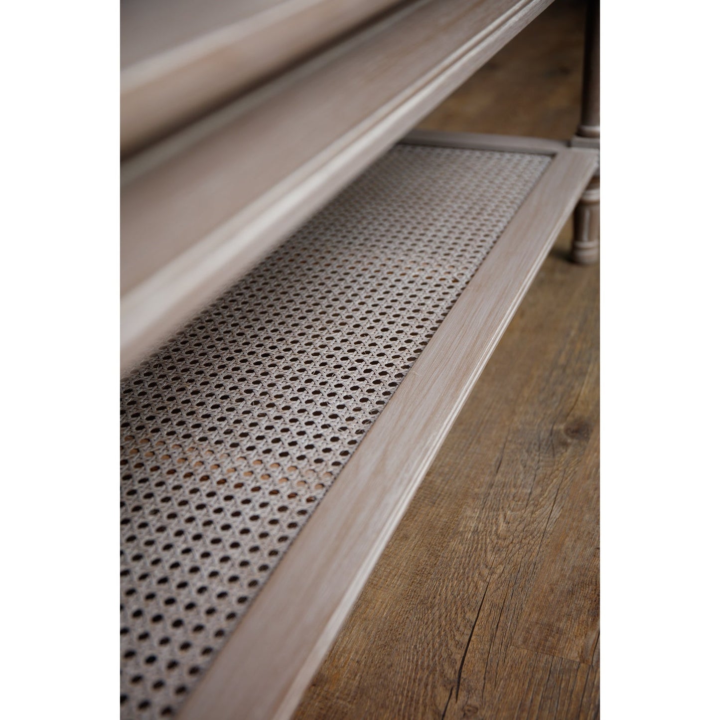 side view of rattan shelf on coffee table