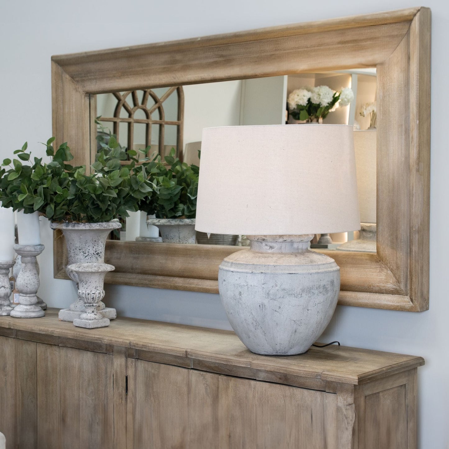 large wooden mirror above sideboard