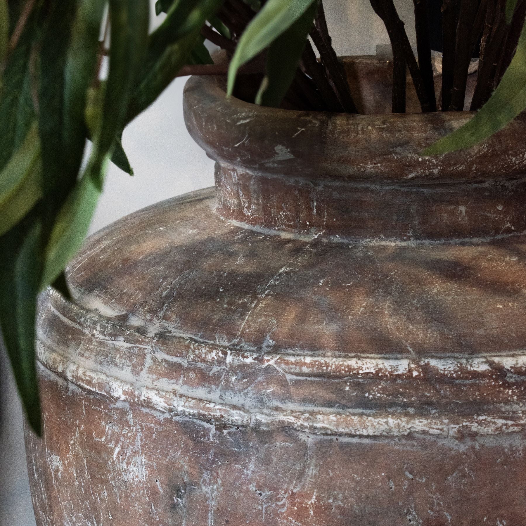 close up neck detail of large rustic water pot vase