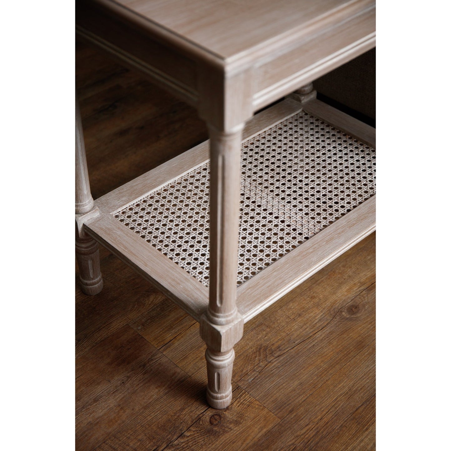 downward view of side table with rattan shelf