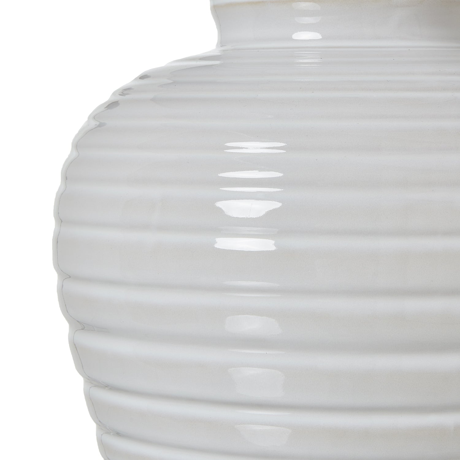 close up of the ribbed ceramic base on the white lamp