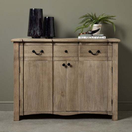 1 drawer 2 door sideboard with potted plant to the top and a small and large vase to the left hand side