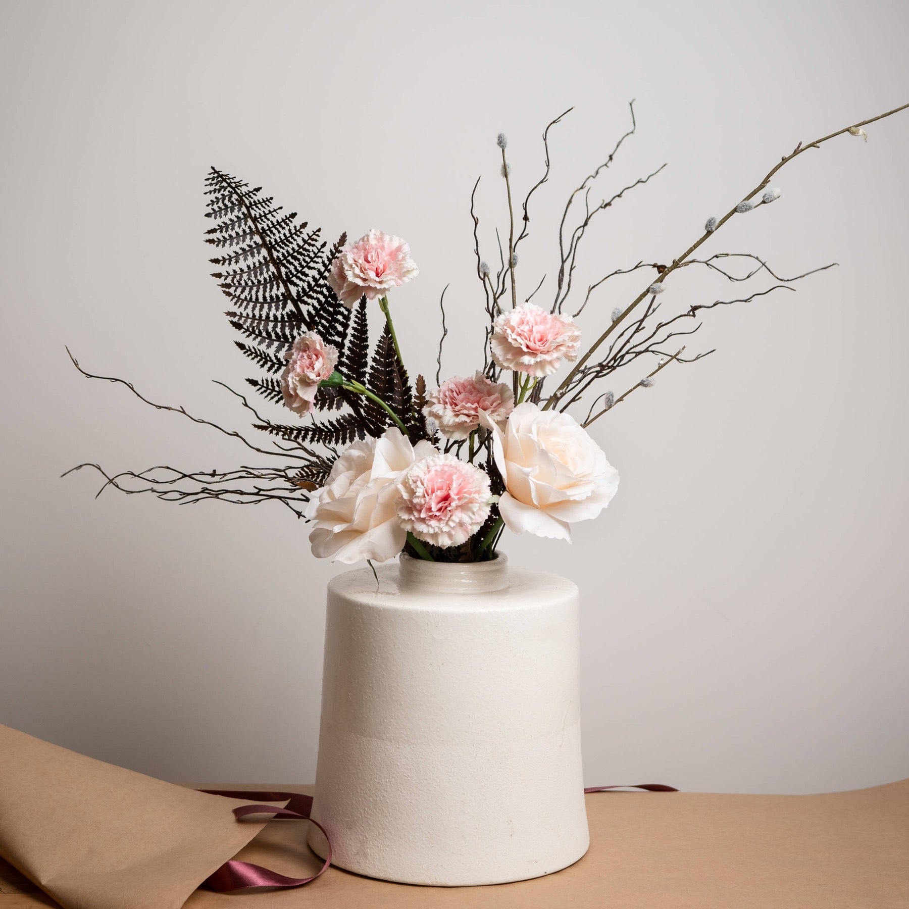 branch spray used within artificial flower display to add texture