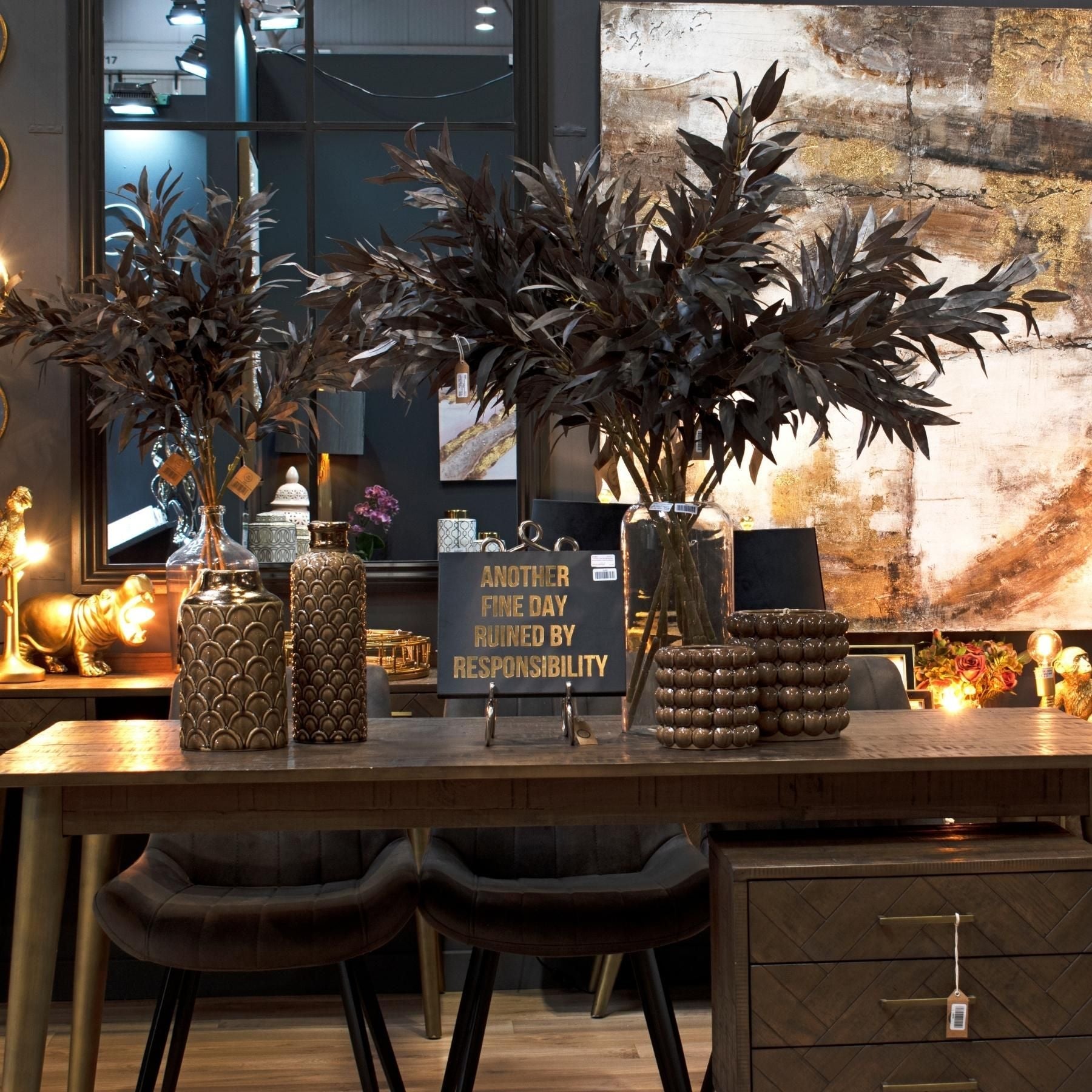 Small and Large bubble planters to the right of dining table display. Caramel Scalloped vases to the left and burgundy foliage in glass vases at the back