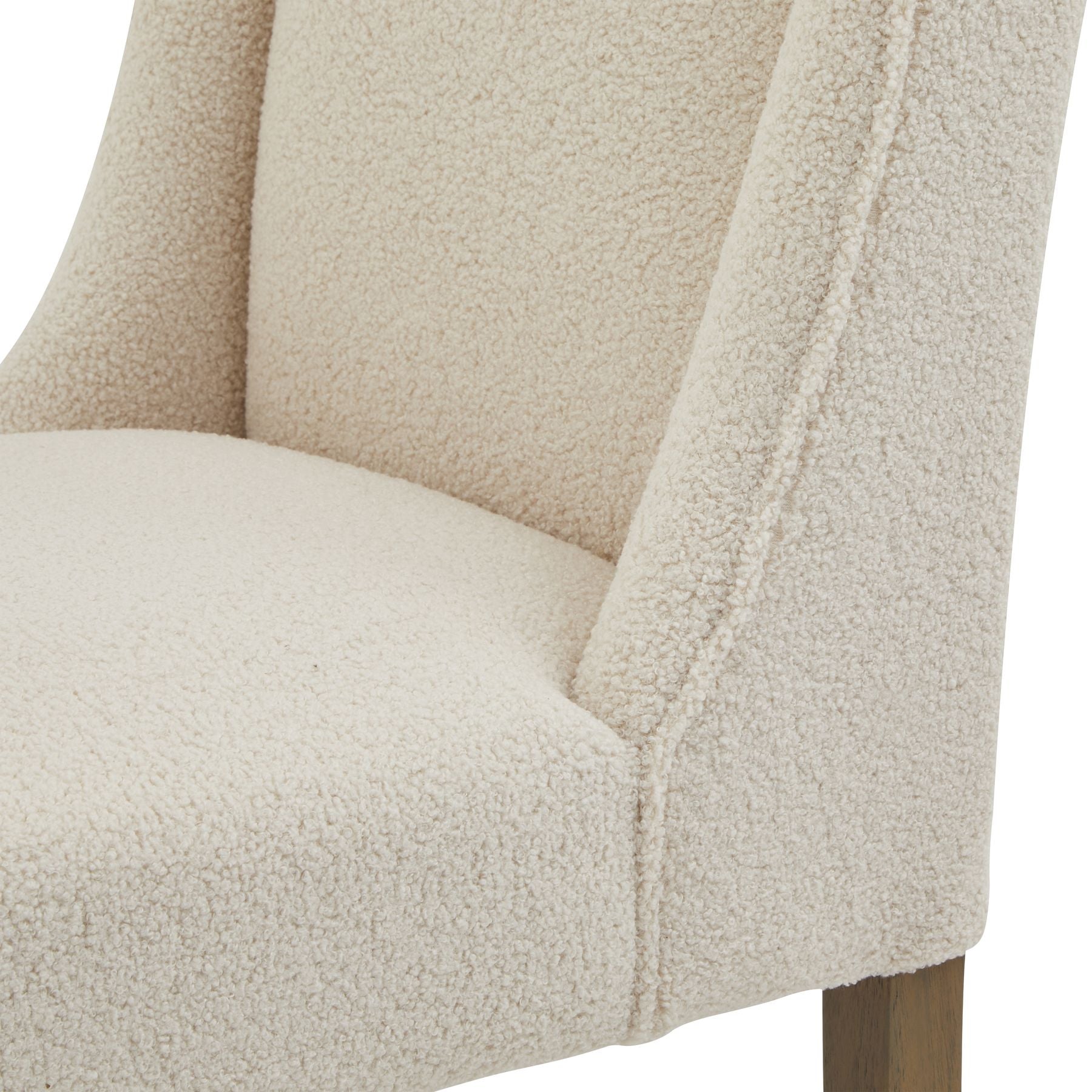 close up of the back and seat pad on the chelsea boucle dining chair