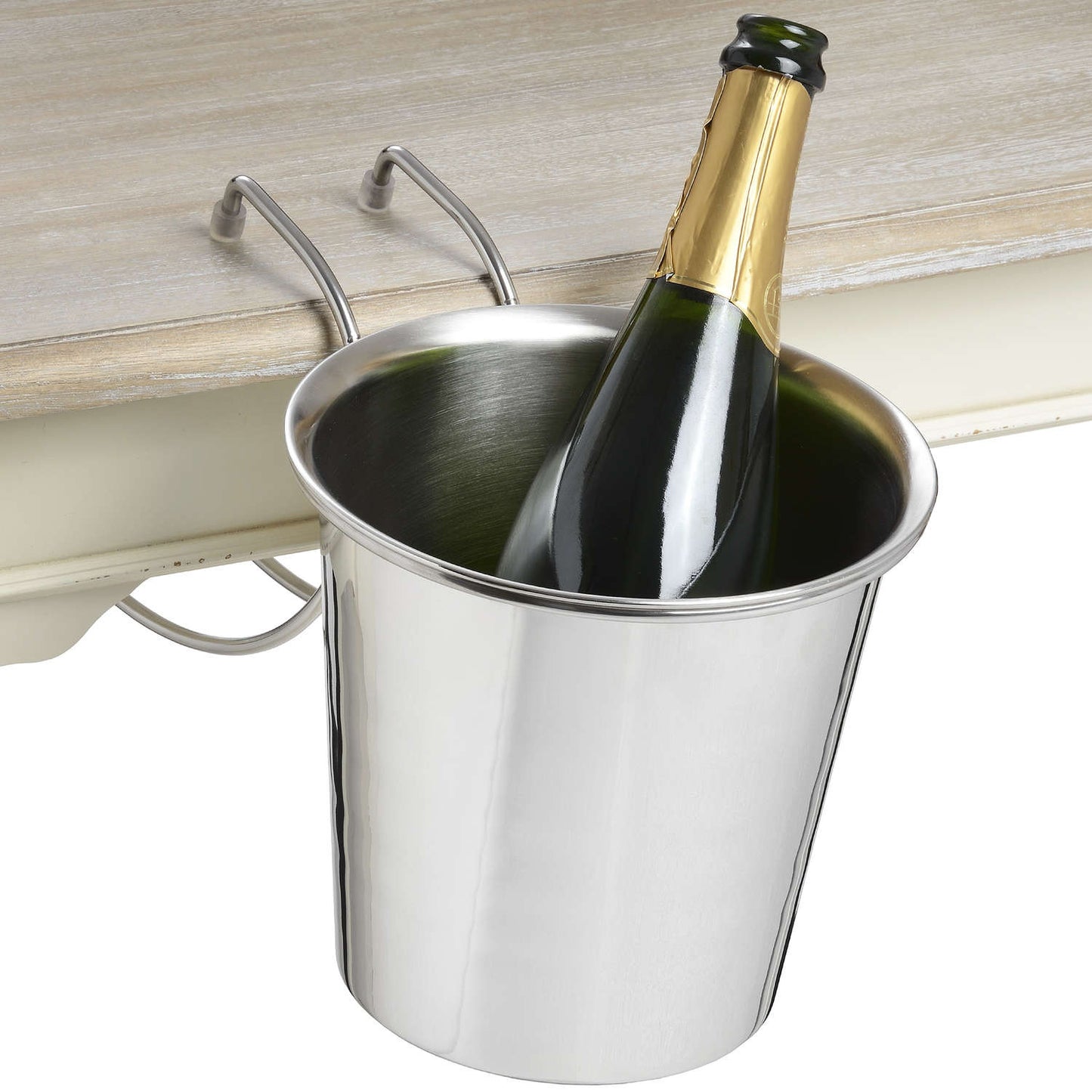 champagne bucket hanging on side of table