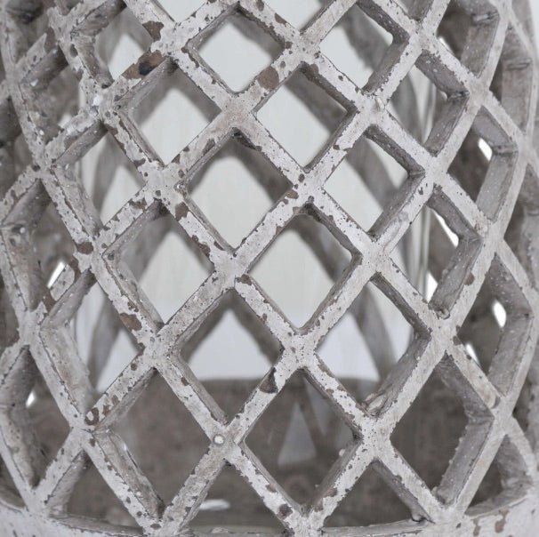 close up of the lattice aged stone hurricane lantern