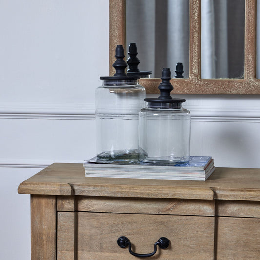 both sizes jars placed on a sideboard, with a mirror behind