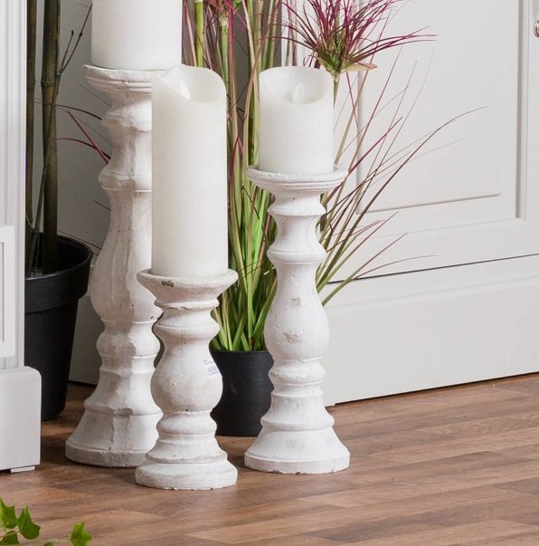 Stone Candlestick collection, showing all three heights available. Displayed as a floorstanding arrangement